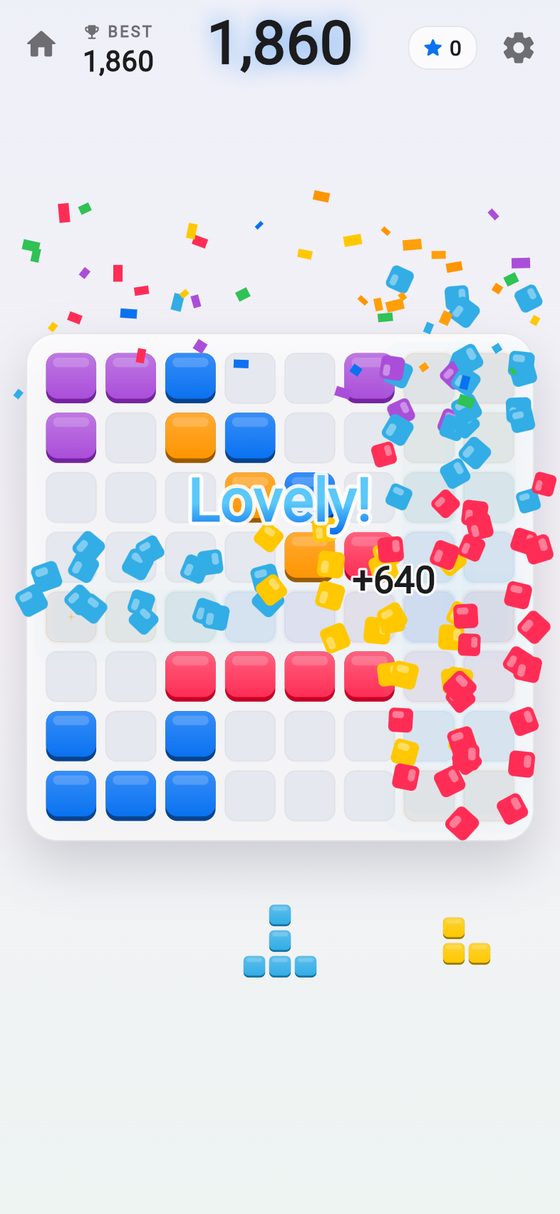 Lines clearing in a burst of confetti, with the game's praise and the combo or points it earned.